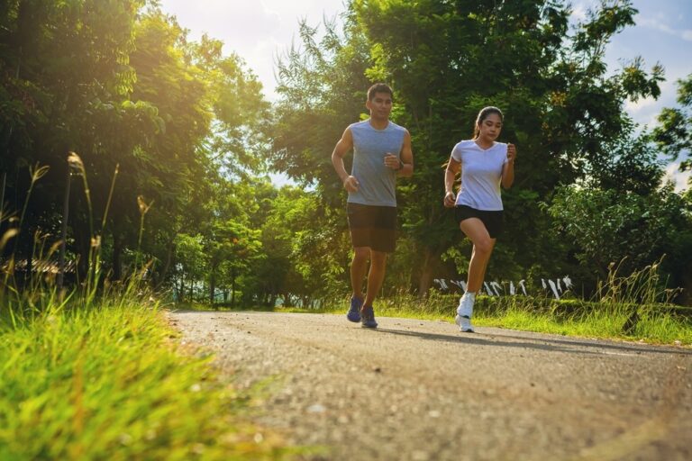 Silhouette,Of,Young,Couple,Running,Together,On,Road.,Couple,,Fit